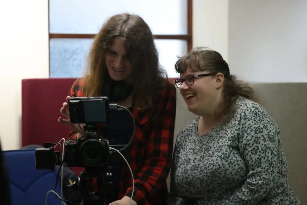 Bethany and Alice working with cameras in the workplace programme at whamos training and development
